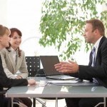 Sales people listening to a story from the buyer